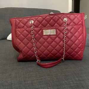 Red quilted hand bag. Good condition.